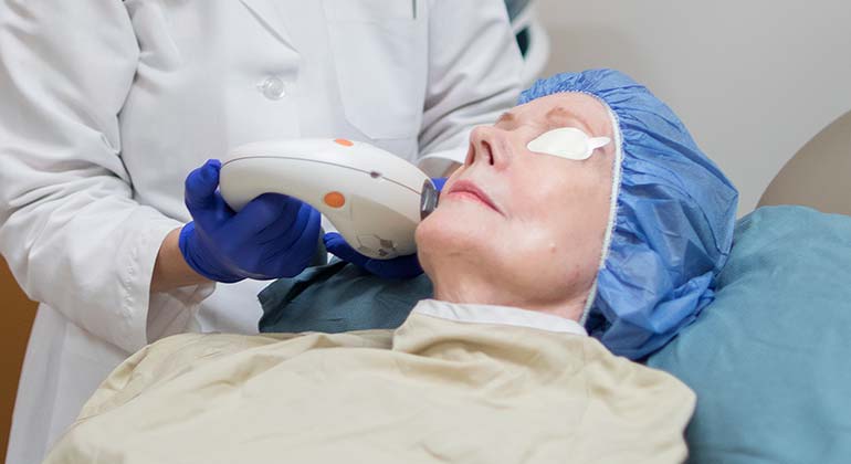 Image of Doctor performing laser procedure on patient