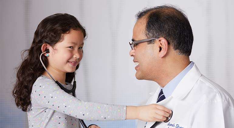 image of doctor and little girl