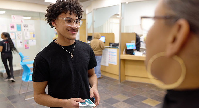 image of teenager talking to an adult