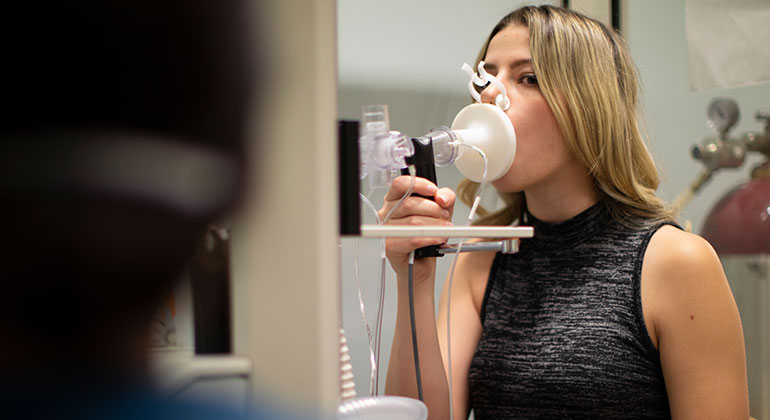 Female patient doing a breathing test