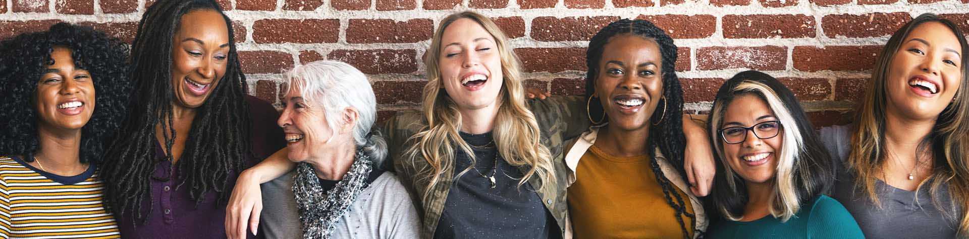 a group of women smiling