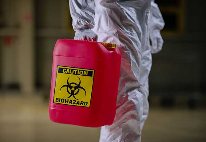 A photo of container with a “biohazard” marking