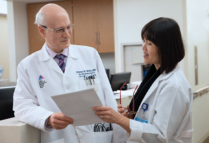 A photo of Edward M. Wolin, MD, and Siok (Ann) Khor, NP