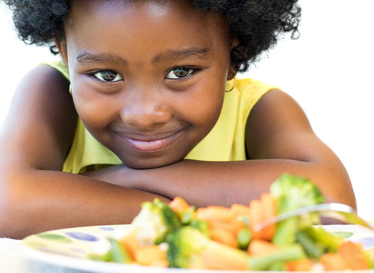 Photo of Young child with healthy food