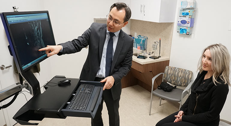image of doctor showing scans to patient