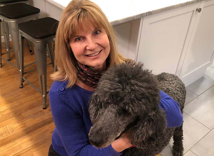 Photo of Lorraine Dibble holding her dog