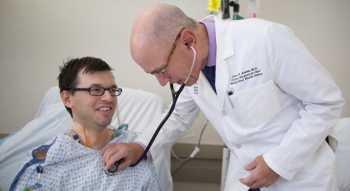 Image of Dr. David Adams with patient