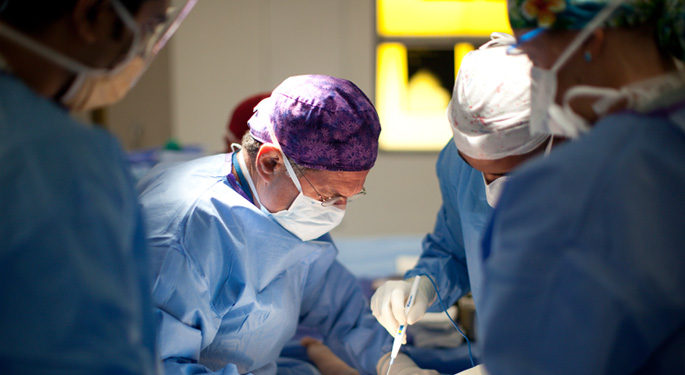 Image of orthopedic trauma surgeons during surgical procedure