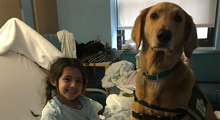 Image of little girl with dog