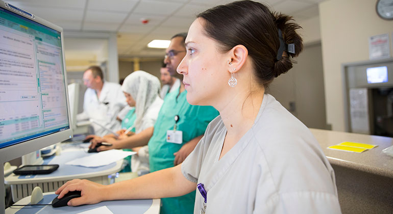 Doctor's assistant on a computer