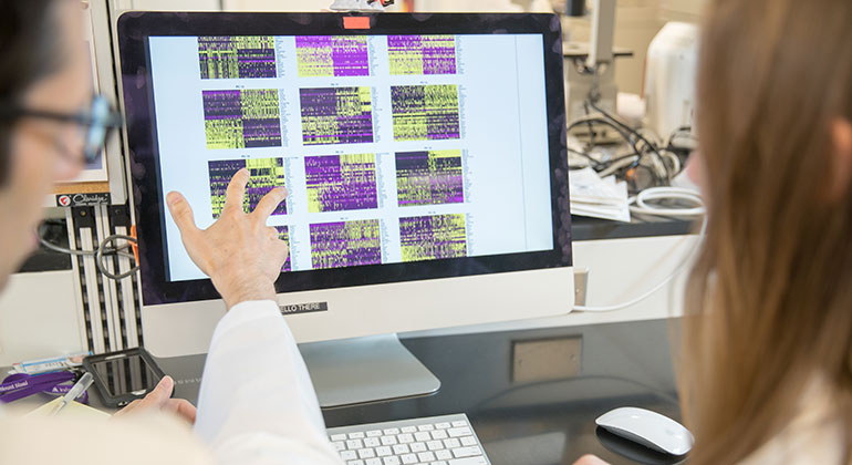 Doctor pointing at computer