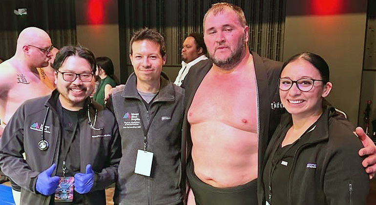 sumo wrestler and team