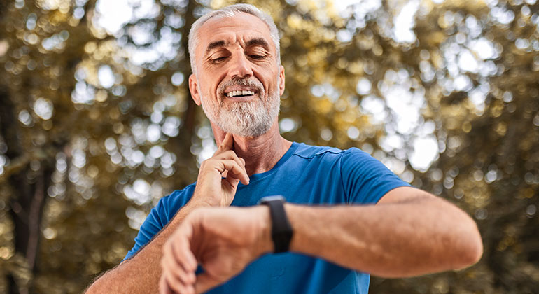Image of man checking his pulse