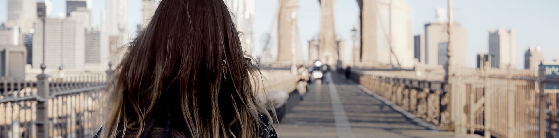 Girl walking on a bridge