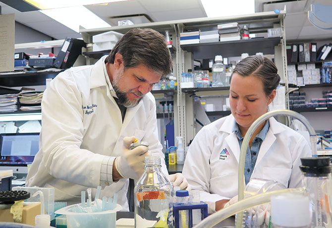 Image of Julio Aguirre-Ghiso, PhD, and graduate student Kathryn Harper