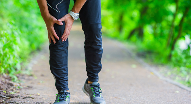 Person clutching knee