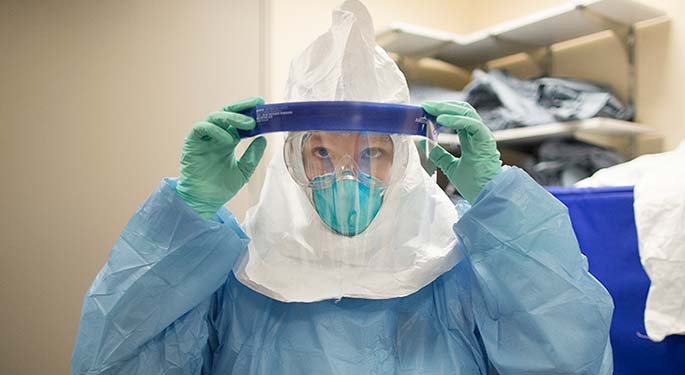 Image of woman wearing hospital gown