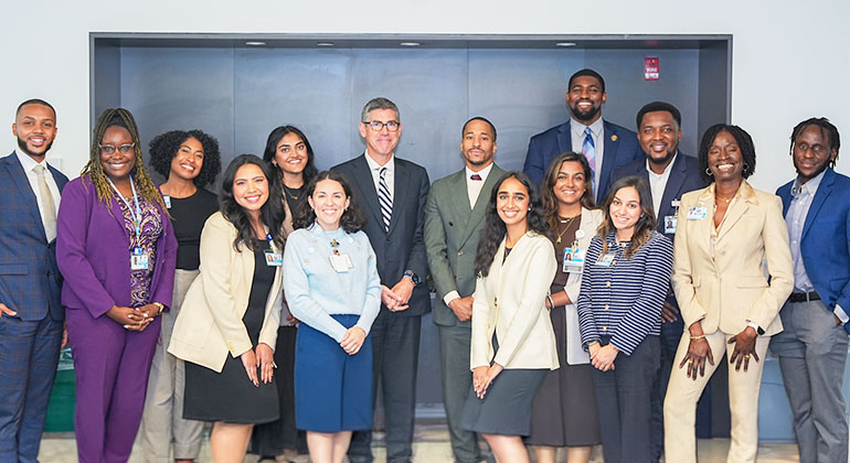 Office for Health Data, Outcomes, and Engagement Strategy team members taking a photo with Dr. Carr (if too long then use: HDOES team members taking a photo with Dr. Carr)