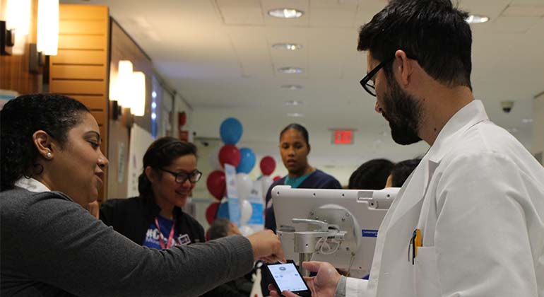 Staff speaking to attendee