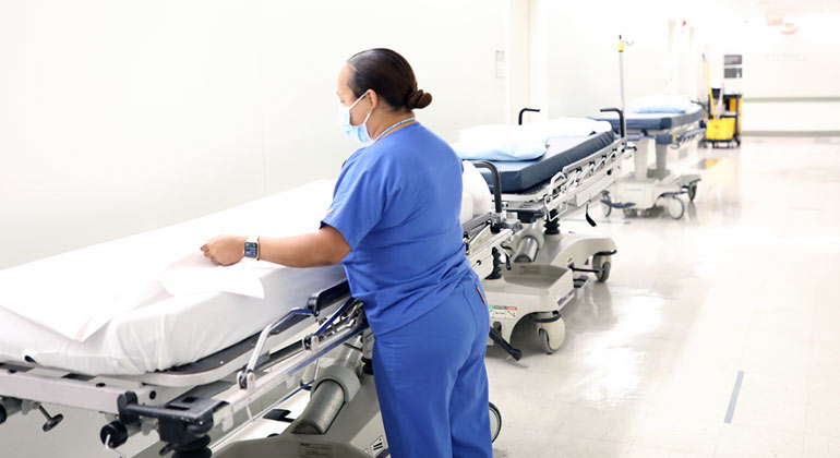 Nurse near hospital bed