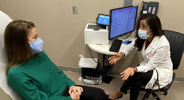 Image of doctor talking to patient