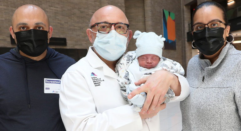 Image of doctor holding baby