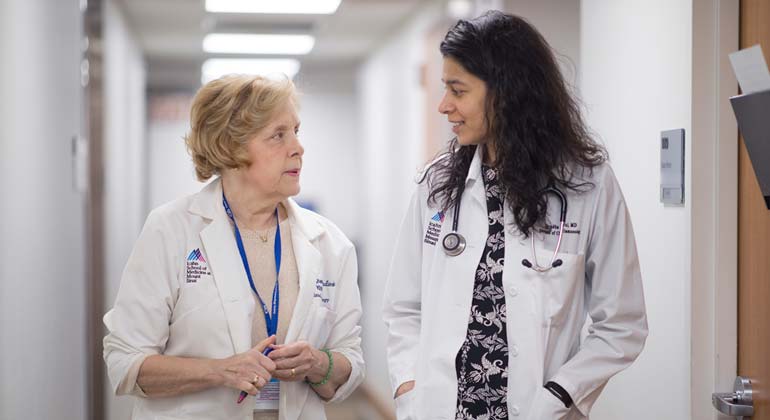 Two doctors walking in the hallway