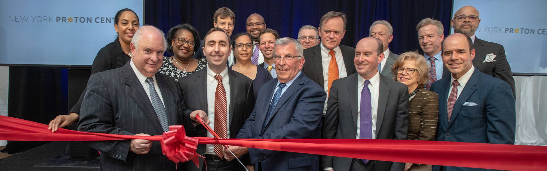 NY Proton Center team cutting ribbon
