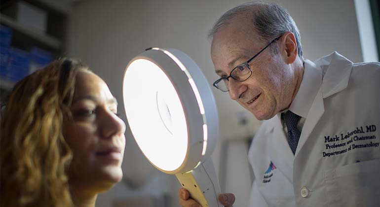 Image of Dr. Mark Lebwohl and patient