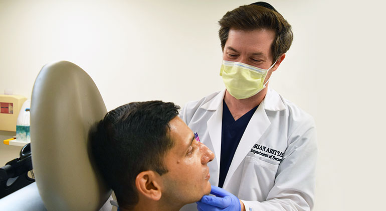 Image of doctor treating patient