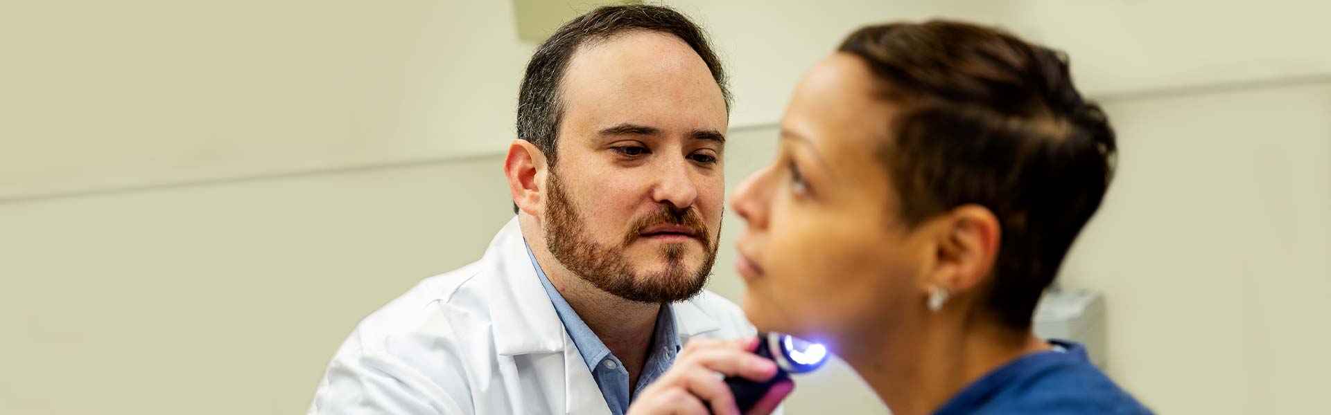 Image of doctor examining patient