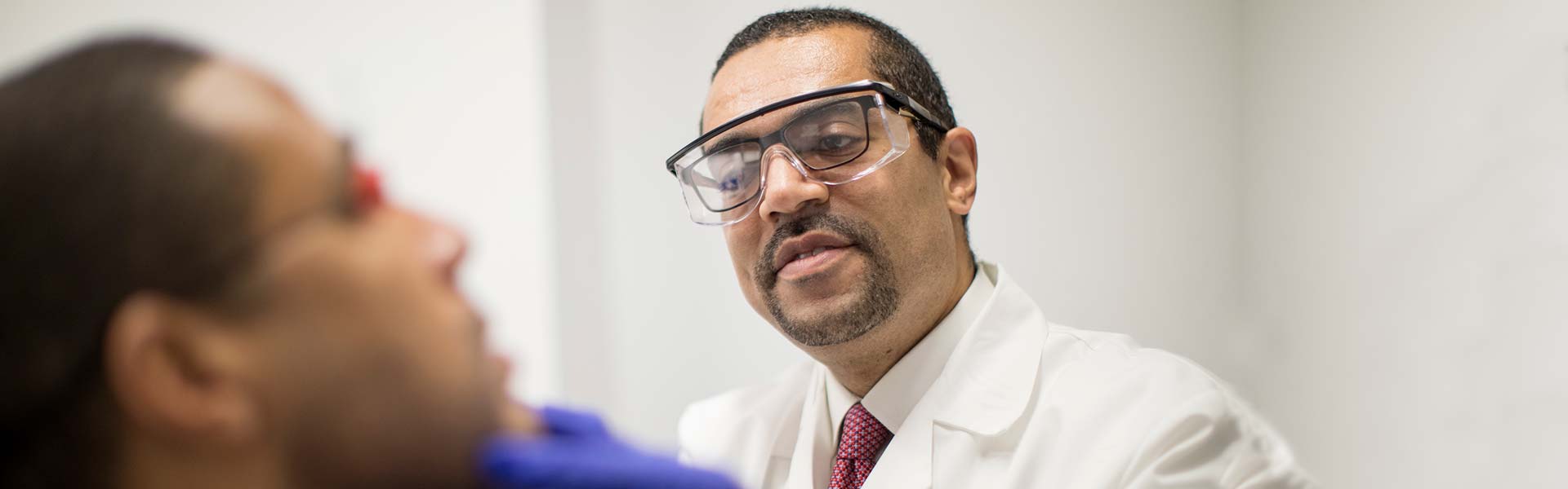 Dr. Andrew Alexis of Skin of Color Center with patient