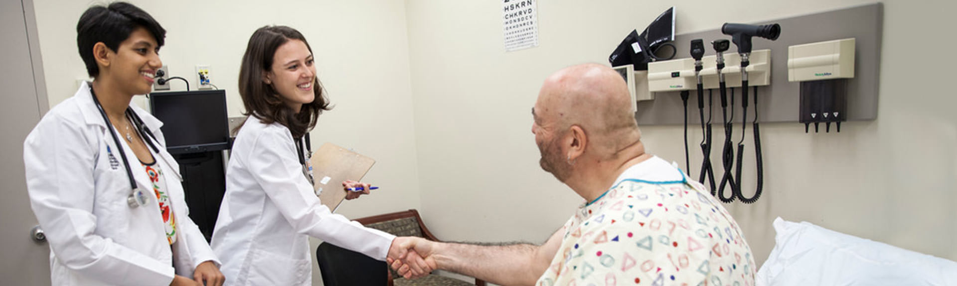 Two doctors meeting with a patient