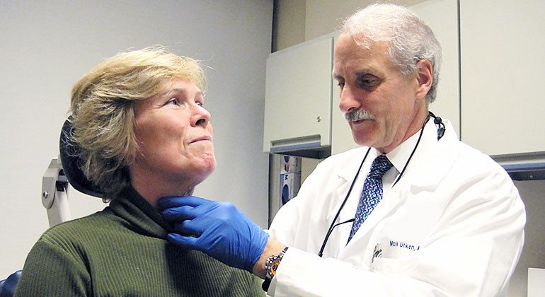 Image of doctor examining patient