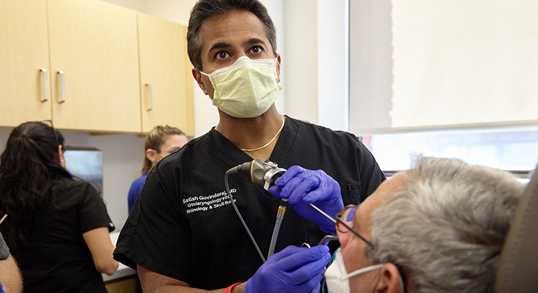 Image of doctor examining patient