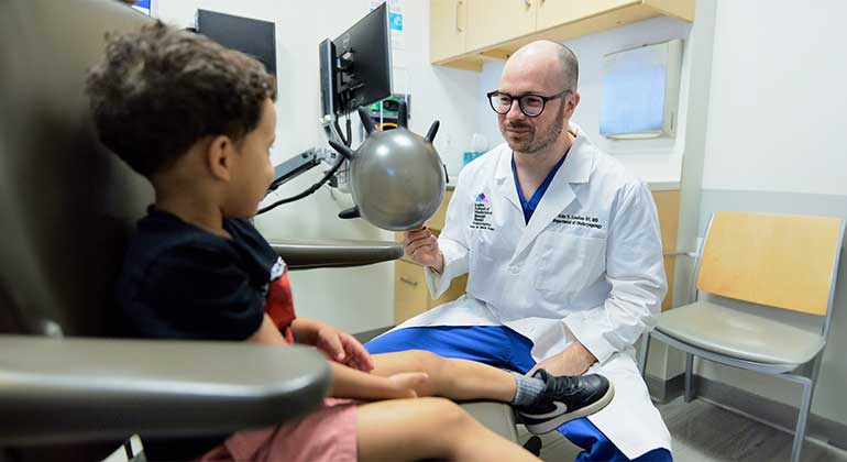 Image of doctor with a child patient