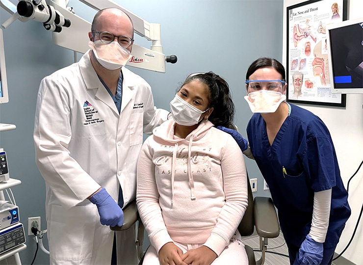 Photo of Peds ENT patient with doctor and nurse