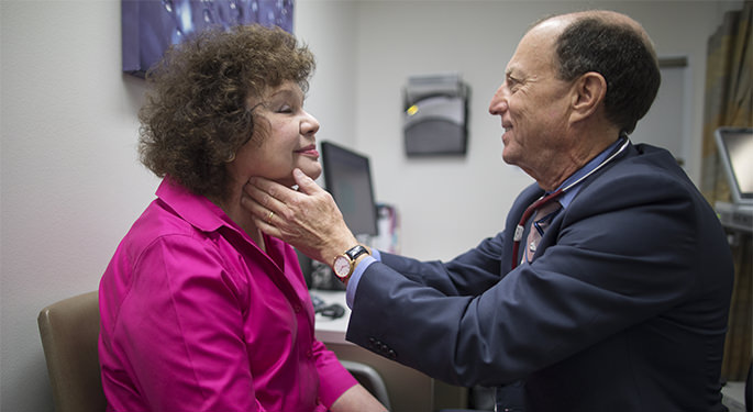 Dr. Richard Haber examines a patient