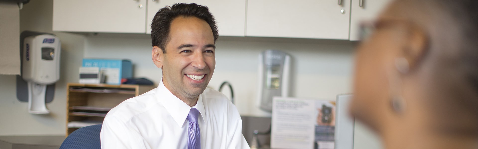 Dr. Michael Via talks to endocrine patient