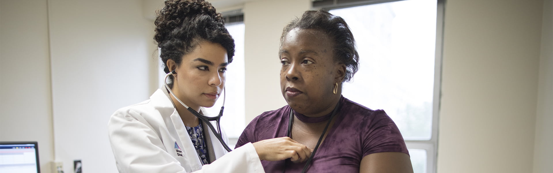 Dr. Maria Brito examines an endocrine patient