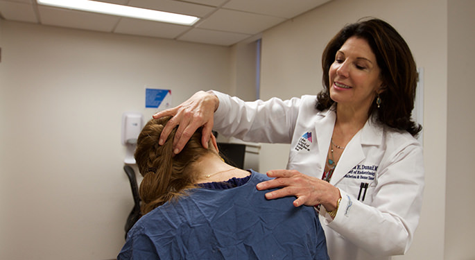 Doctor examining female patient