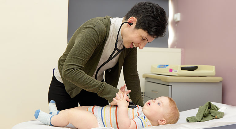 doctor examining baby