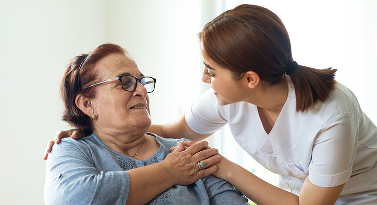 geriatric patient being assisted
