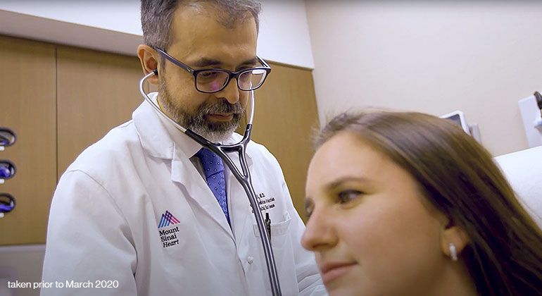 Image of doctor examining patient