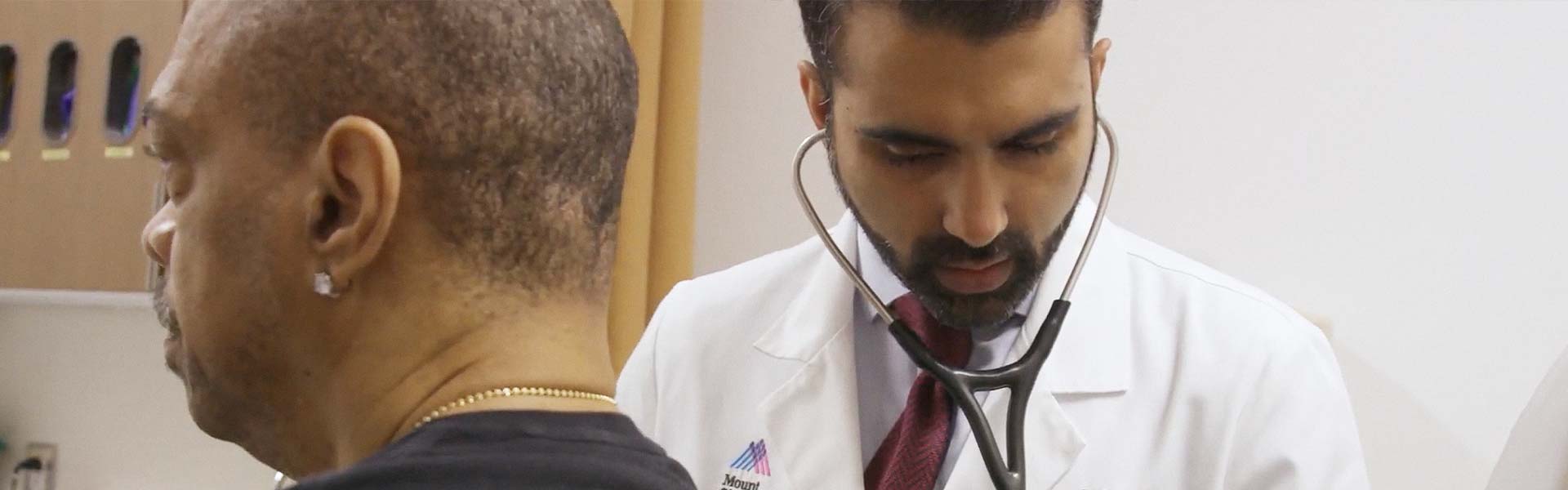Image of doctor examining patient