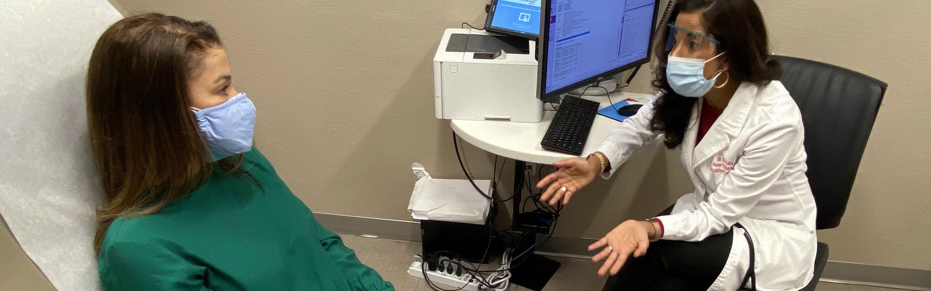 Image of doctor talking to patient