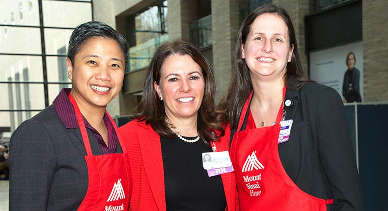 Three women posing at Go Red Event.