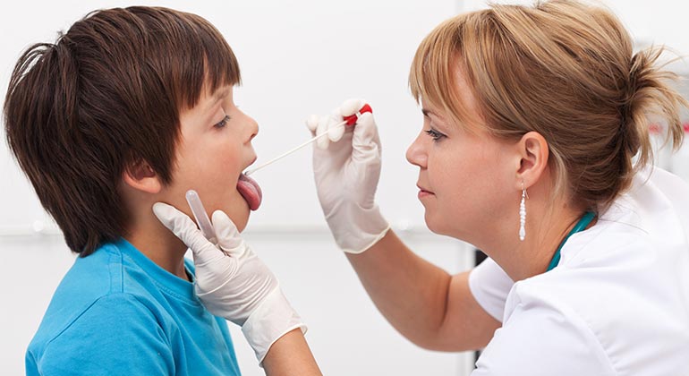 Doctor examining child