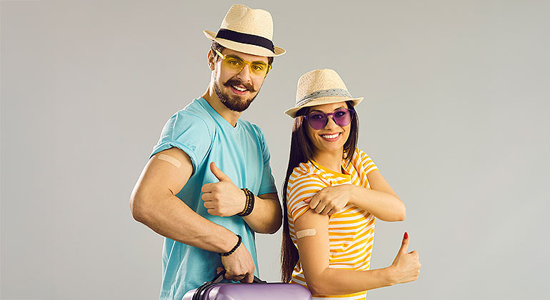 Image of two people taking vaccine