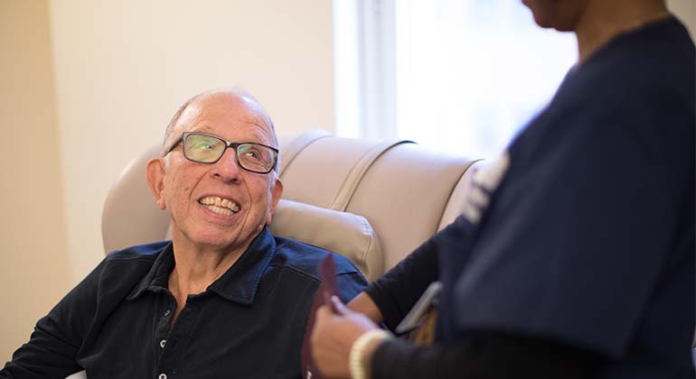 Patient smiling at health care provider